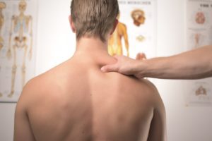 A man having his shoulder massaged