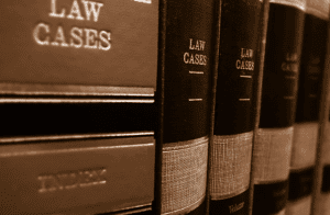 Several leather law books on a book shelf