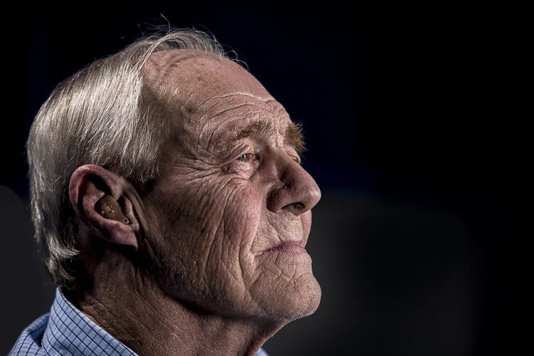 Image of an elderly man with a hearing aid