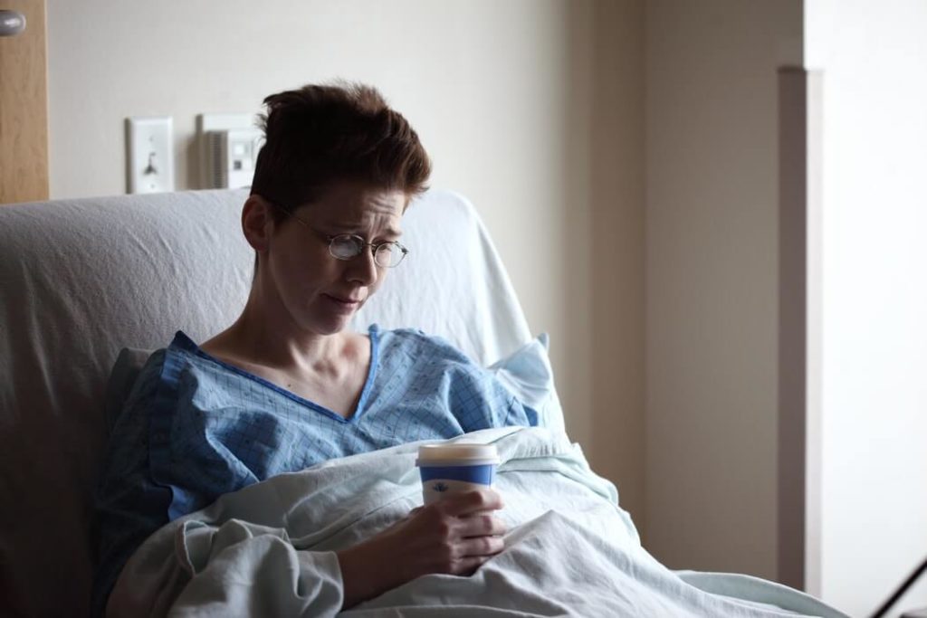 A woman sitting in a hospital bed